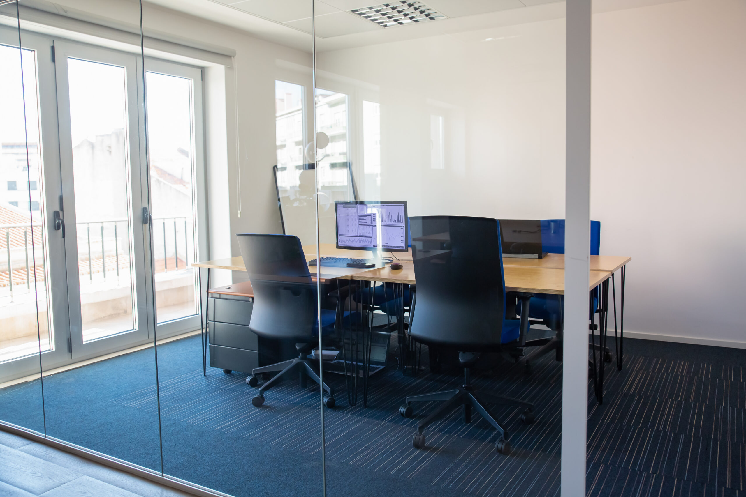 Empty boardroom behind glass wall