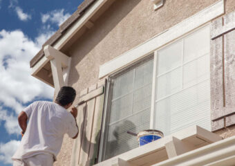 Professional,House,Painter,Painting,The,Trim,And,Shutters,Of,A